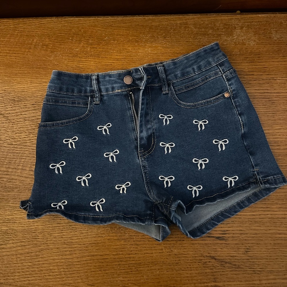 denim jean shorts with embroidered bows